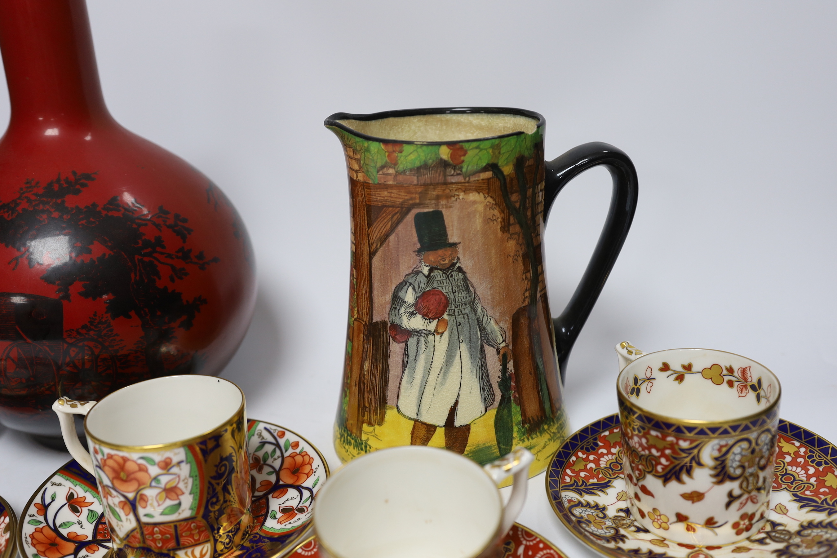 A Doulton flambé vase, a Gaffers Seriesware jug and Royal Crown Derby Imari cups and saucers, tallest 25.5cm